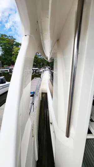 Sea-solar Sue & Lectric Lee Yacht Photos Pics 2022 Greenline 40 yacht side view, showcasing sleek design and marina setting.