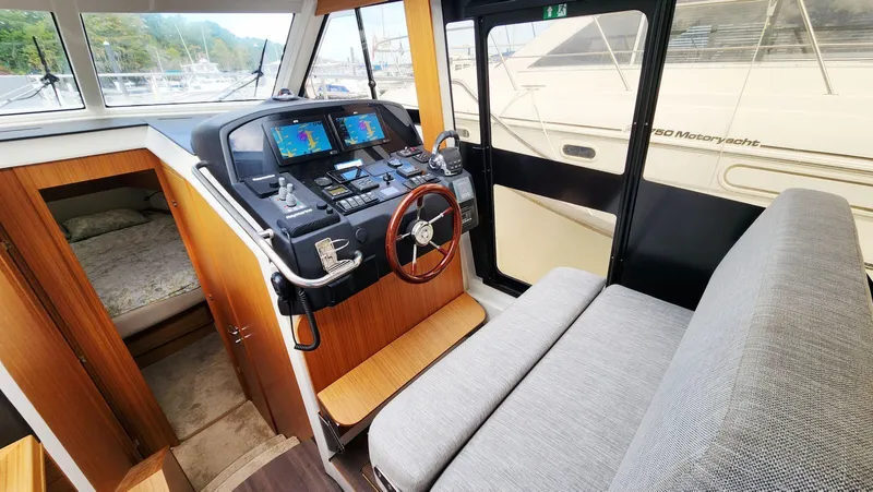 Sea-solar Sue & Lectric Lee Yacht Photos Pics Interior of 2022 Greenline 40 yacht with helm, seating, and cabin view.