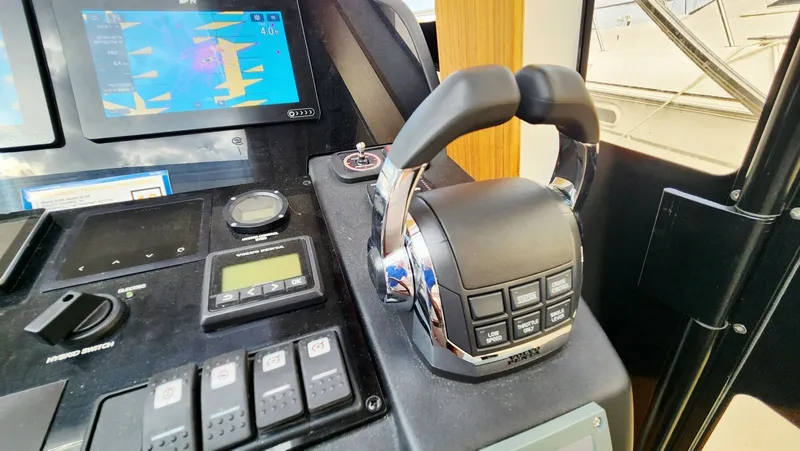 Sea-solar Sue & Lectric Lee Yacht Photos Pics Control panel of 2022 Greenline 40 yacht with navigation and throttle controls.