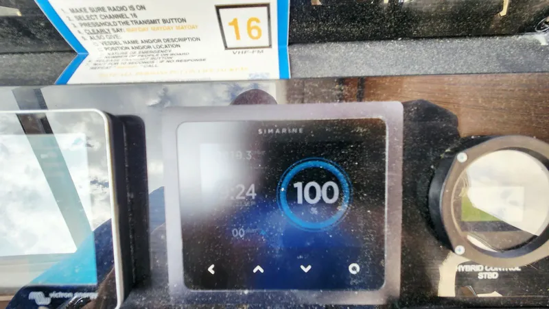 Sea-solar Sue & Lectric Lee Yacht Photos Pics Control panel of a 2022 Greenline 40 boat, displaying a Simarine screen and hybrid controls.