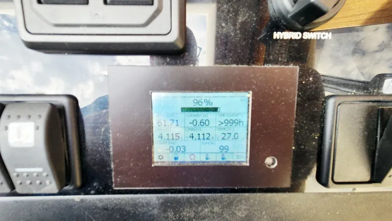 Sea-solar Sue & Lectric Lee Yacht Photos Pics Control panel of 2022 Greenline 40 boat with hybrid switch and digital display.