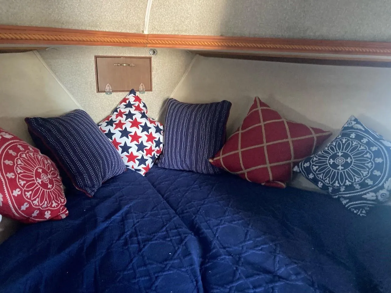 Cozy cabin interior with colorful pillows on a Pacemaker 33, 1969 model.