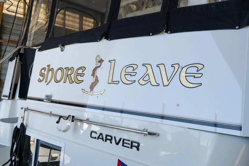 Shore Leave Yacht Photos Pics 1998 Carver 355 Aft Cabin boat with "Shore Leave" name on the stern.