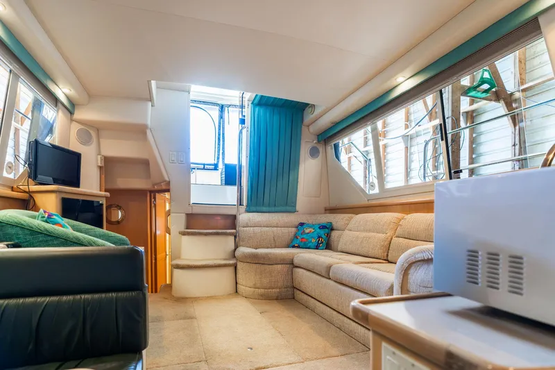 Shore Leave Yacht Photos Pics Interior of 1998 Carver 355 Aft Cabin yacht with cozy seating and modern amenities.