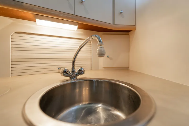 Shore Leave Yacht Photos Pics Stainless steel sink in 1998 Carver 355 Aft Cabin yacht kitchen.