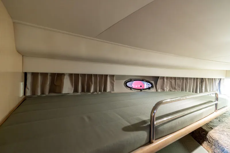 Shore Leave Yacht Photos Pics 1998 Carver 355 Aft Cabin interior with bed, porthole, and curtains.