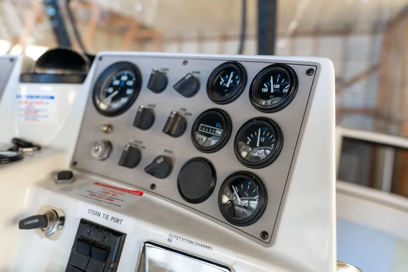 Shore Leave Yacht Photos Pics Control panel of a 1998 Carver 355 Aft Cabin boat with gauges and switches.