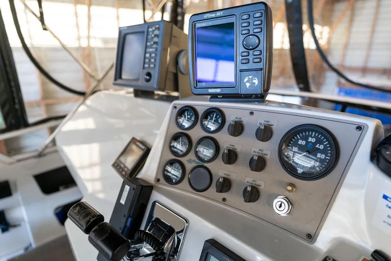 Shore Leave Yacht Photos Pics Control panel of 1998 Carver 355 Aft Cabin with GPS and gauges.