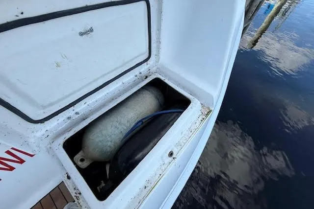  Yacht Photos Pics Storage compartment on a 2005 Hunter 38 boat, containing a propane tank.