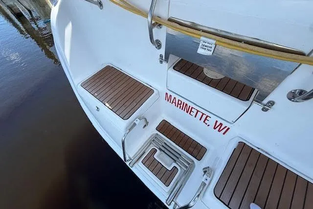  Yacht Photos Pics Stern view of 2005 Hunter 38 sailboat with teak decking, Marinette, WI.