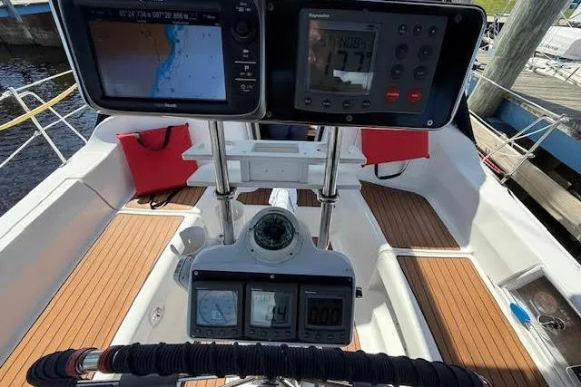  Yacht Photos Pics Cockpit of 2005 Hunter 38 sailboat with navigation instruments and teak flooring.