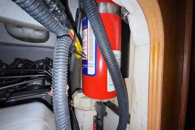  Yacht Photos Pics Fire extinguisher in 2005 Hunter 38 boat engine compartment with wiring and hoses.