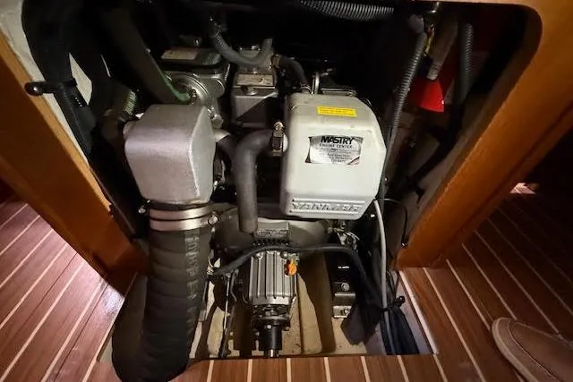  Yacht Photos Pics Engine compartment of a 2005 Hunter 38 sailboat, featuring a Yanmar diesel engine.