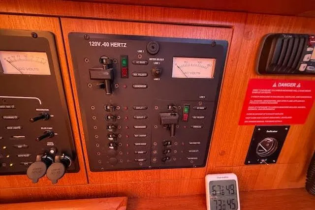  Yacht Photos Pics Electrical control panel on a 2005 Hunter 38 sailboat, featuring voltage meters and switches.