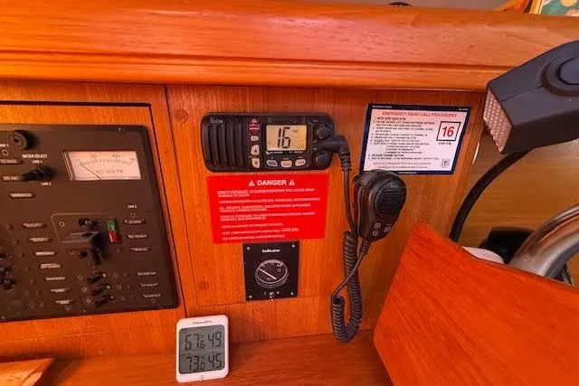 Yacht Photos Pics Control panel of a 2005 Hunter 38 sailboat with radio and temperature display.