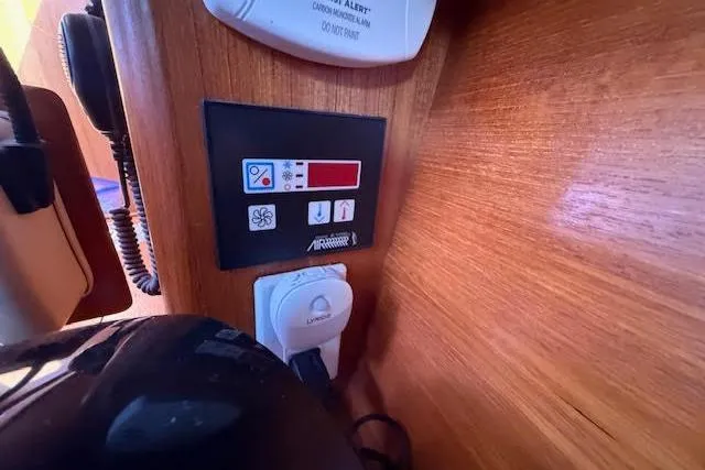  Yacht Photos Pics Control panel inside a 2005 Hunter 38 yacht, featuring various switches and displays.