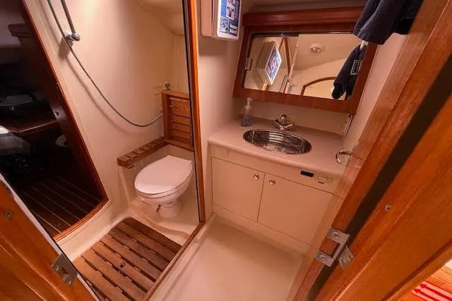  Yacht Photos Pics 2005 Hunter 38 yacht bathroom with shower, toilet, and sink.