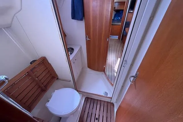  Yacht Photos Pics 2005 Hunter 38 yacht bathroom with wooden accents and compact design.