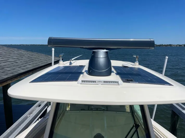 Exit Strategy Yacht Photos Pics 2020 Scout 355 LXF Center Console boat with radar and solar panels on the roof.