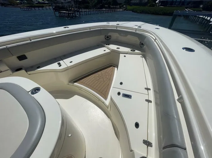 Exit Strategy Yacht Photos Pics 2020 Scout 355 LXF Center Console boat interior with seating and storage compartments.