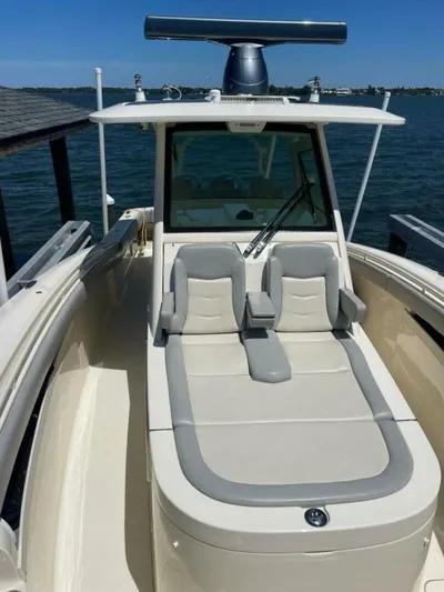 Exit Strategy Yacht Photos Pics 2020 Scout 355 LXF Center Console boat with luxurious seating on the water.
