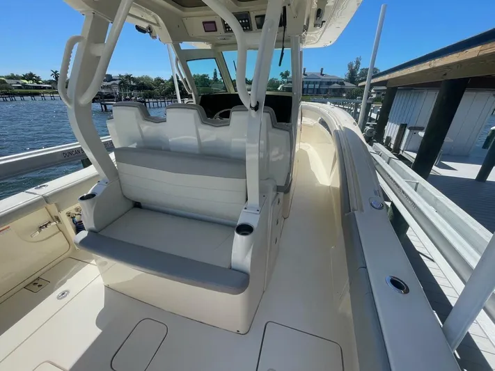 Exit Strategy Yacht Photos Pics 2020 Scout 355 LXF Center Console boat interior with seating and helm station.