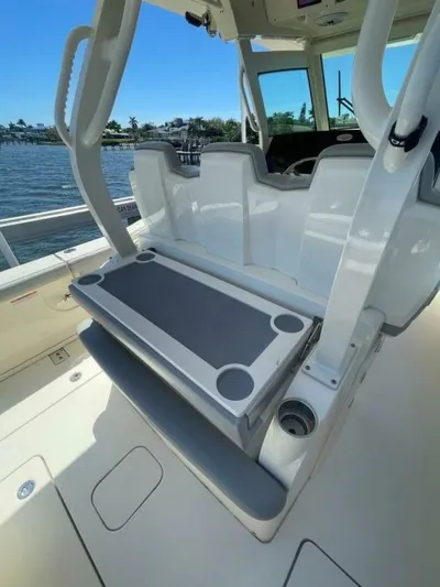 Exit Strategy Yacht Photos Pics 2020 Scout 355 LXF Center Console boat interior with seating and table.
