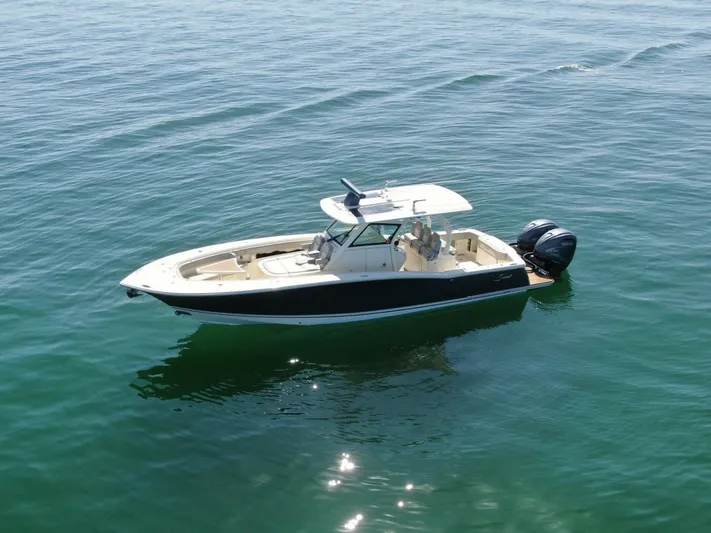 Exit Strategy Yacht Photos Pics 2020 Scout 355 LXF Center Console boat on calm water.