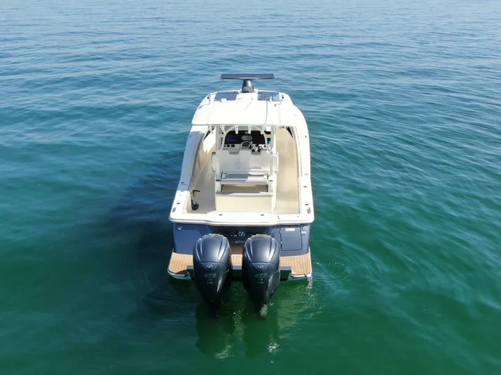 Exit Strategy Yacht Photos Pics 2020 Scout 355 LXF Center Console boat on calm water.