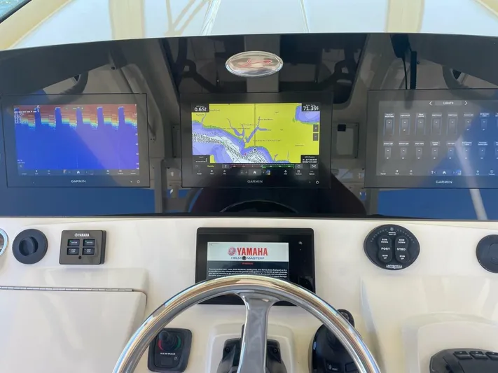 Exit Strategy Yacht Photos Pics 2020 Scout 355 LXF Center Console dashboard with Garmin displays and Yamaha controls.