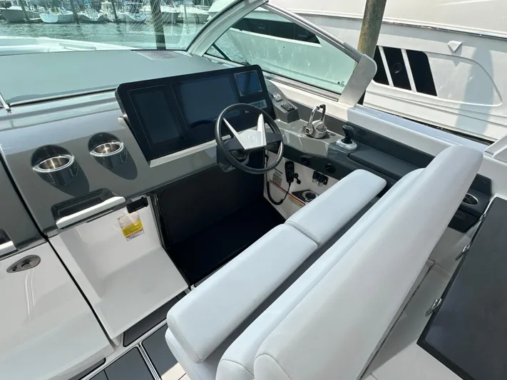 Head Honcho Yacht Photos Pics 2021 Aviara AV36 I/O boat cockpit with modern steering and navigation systems.