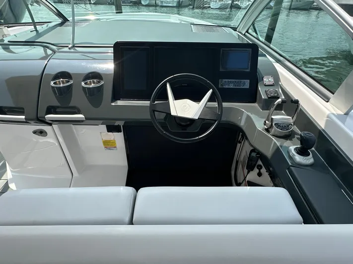 Head Honcho Yacht Photos Pics Cockpit of 2021 Aviara AV36 I/O boat with modern steering and control panel.