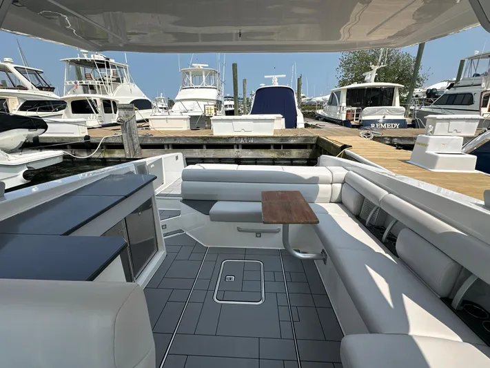 Head Honcho Yacht Photos Pics Luxurious 2021 Aviara AV36 I/O boat interior with spacious seating at a marina.