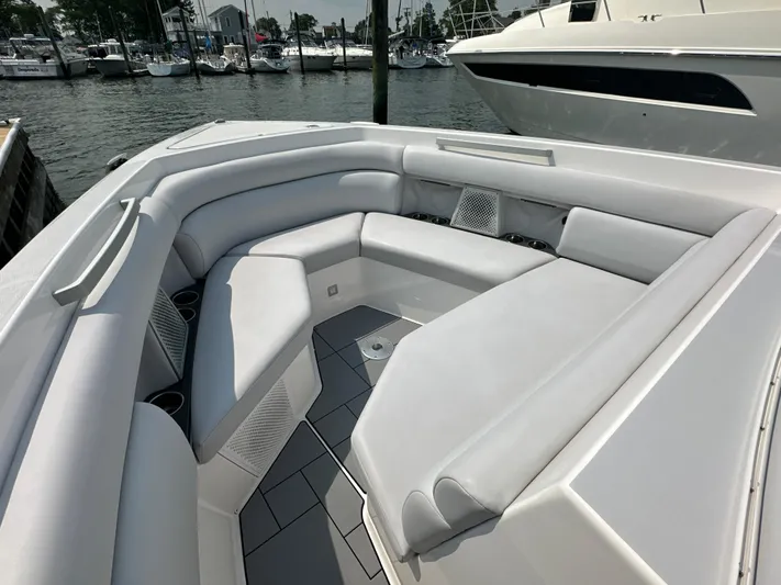 Head Honcho Yacht Photos Pics Luxurious seating area on a 2021 Aviara AV36 I/O boat, docked at a marina.