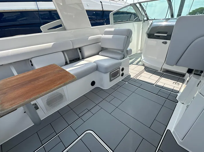 Head Honcho Yacht Photos Pics 2021 Aviara AV36 I/O boat interior with sleek seating and wooden table.