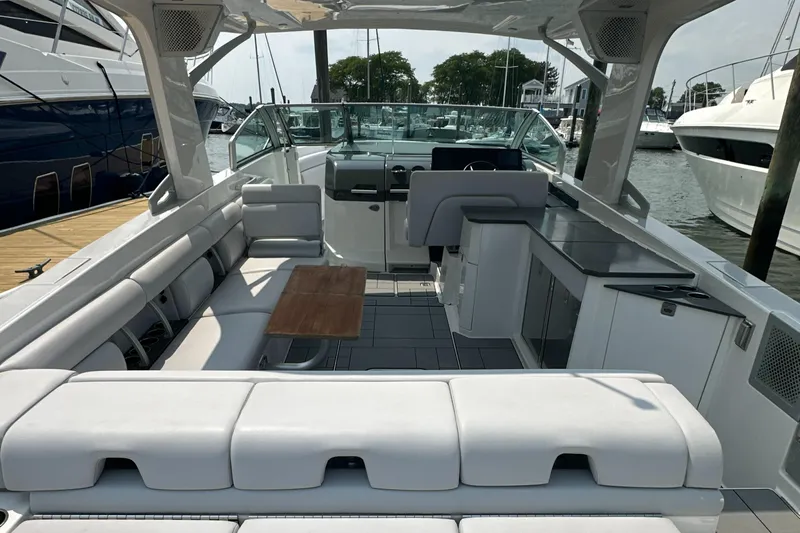 Head Honcho Yacht Photos Pics 2021 Aviara AV36 I/O boat interior with spacious seating and modern amenities at a marina.