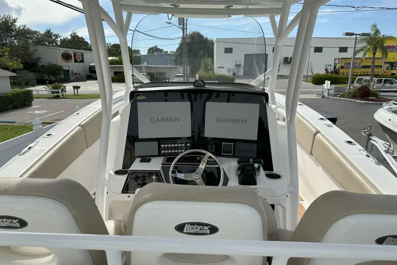  Yacht Photos Pics 2018 Sea Fox 328 Commander boat cockpit with dual Garmin displays and steering wheel.