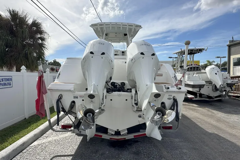 Yacht Photos Pics 2018 Sea Fox 328 Commander boat with dual outboard engines, parked outdoors.