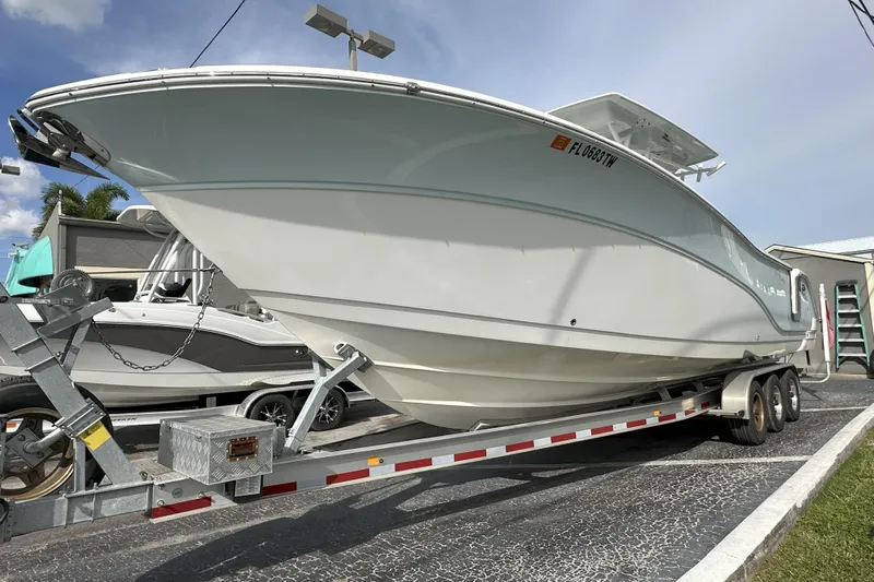  Yacht Photos Pics 2018 Sea Fox 328 Commander boat on trailer, parked outdoors under a clear sky.