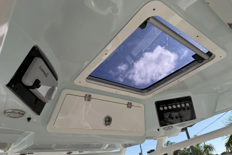  Yacht Photos Pics 2018 Sea Fox 328 Commander boat interior with Garmin equipment and overhead hatch.