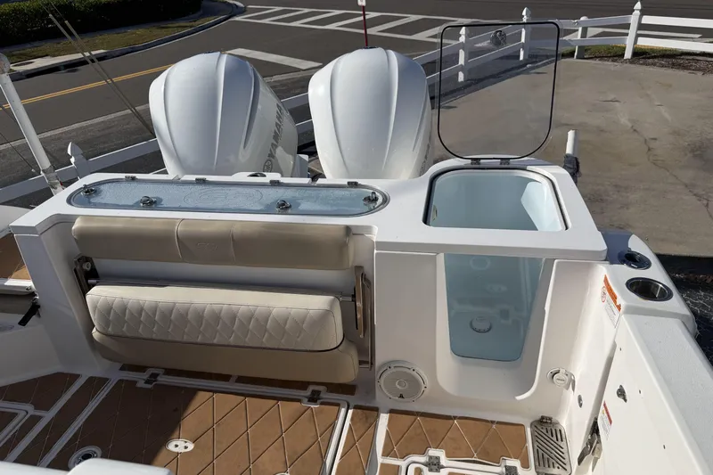  Yacht Photos Pics 2018 Sea Fox 328 Commander boat with dual engines and open storage compartment.