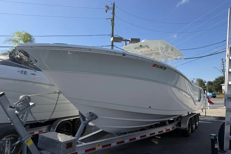  Yacht Photos Pics 2018 Sea Fox 328 Commander boat on trailer under clear blue sky.