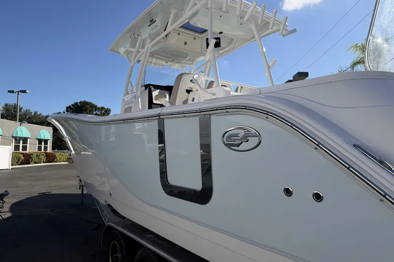  Yacht Photos Pics 2018 Sea Fox 328 Commander boat, sleek design, parked outdoors under clear sky.