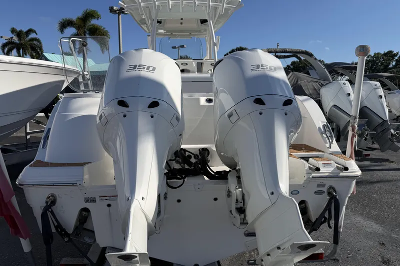  Yacht Photos Pics 2018 Sea Fox 328 Commander with twin 350 horsepower engines, docked under clear skies.
