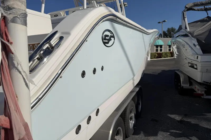  Yacht Photos Pics 2018 Sea Fox 328 Commander boat on trailer, side view in outdoor setting.