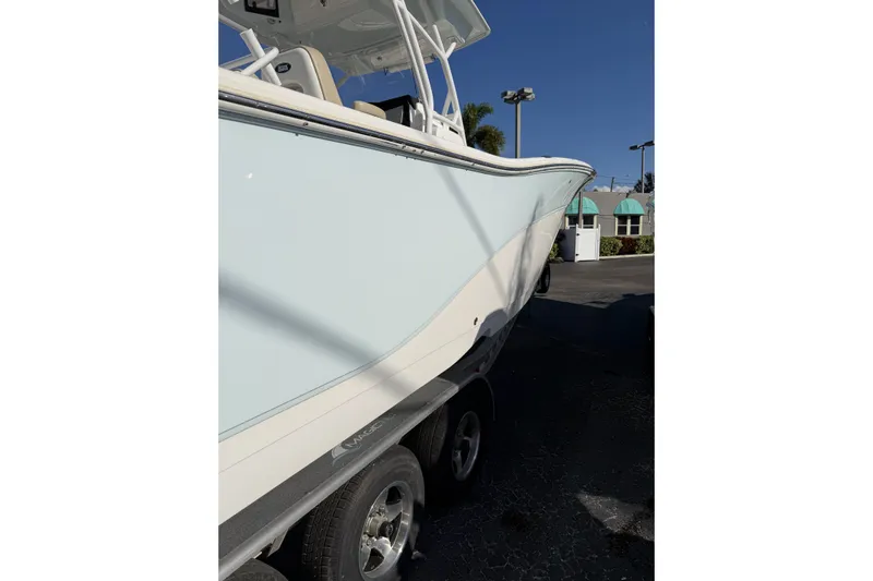 Yacht Photos Pics 2018 Sea Fox 328 Commander boat on trailer, side view under clear blue sky.
