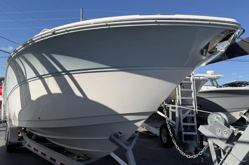  Yacht Photos Pics 2018 Sea Fox 328 Commander boat on trailer, viewed from the front under clear blue sky.