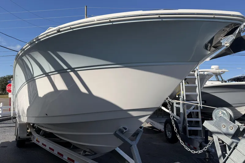  Yacht Photos Pics 2018 Sea Fox 328 Commander boat on trailer, side view under clear blue sky.