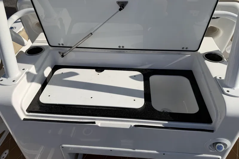  Yacht Photos Pics 2018 Sea Fox 328 Commander boat storage compartment with open lid and cup holders.