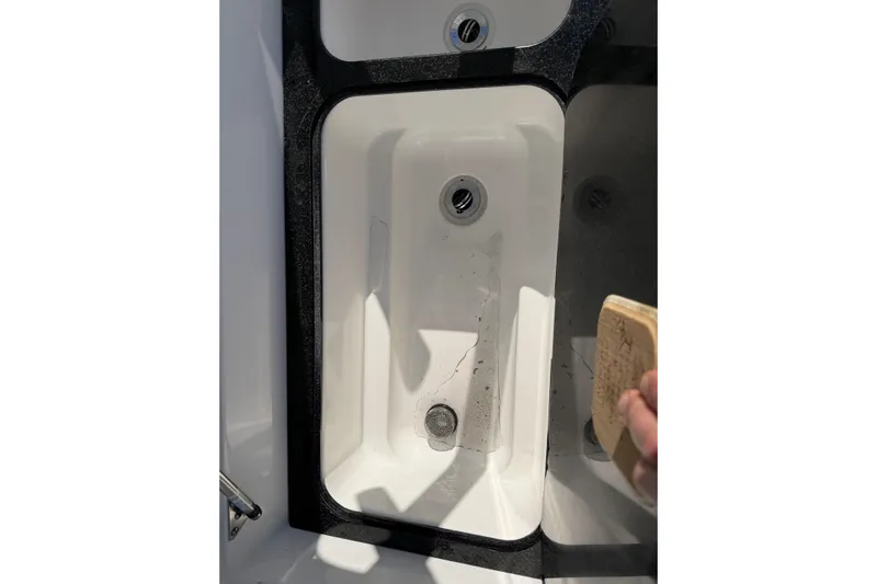  Yacht Photos Pics 2018 Sea Fox 328 Commander boat sink with black trim and visible drain.